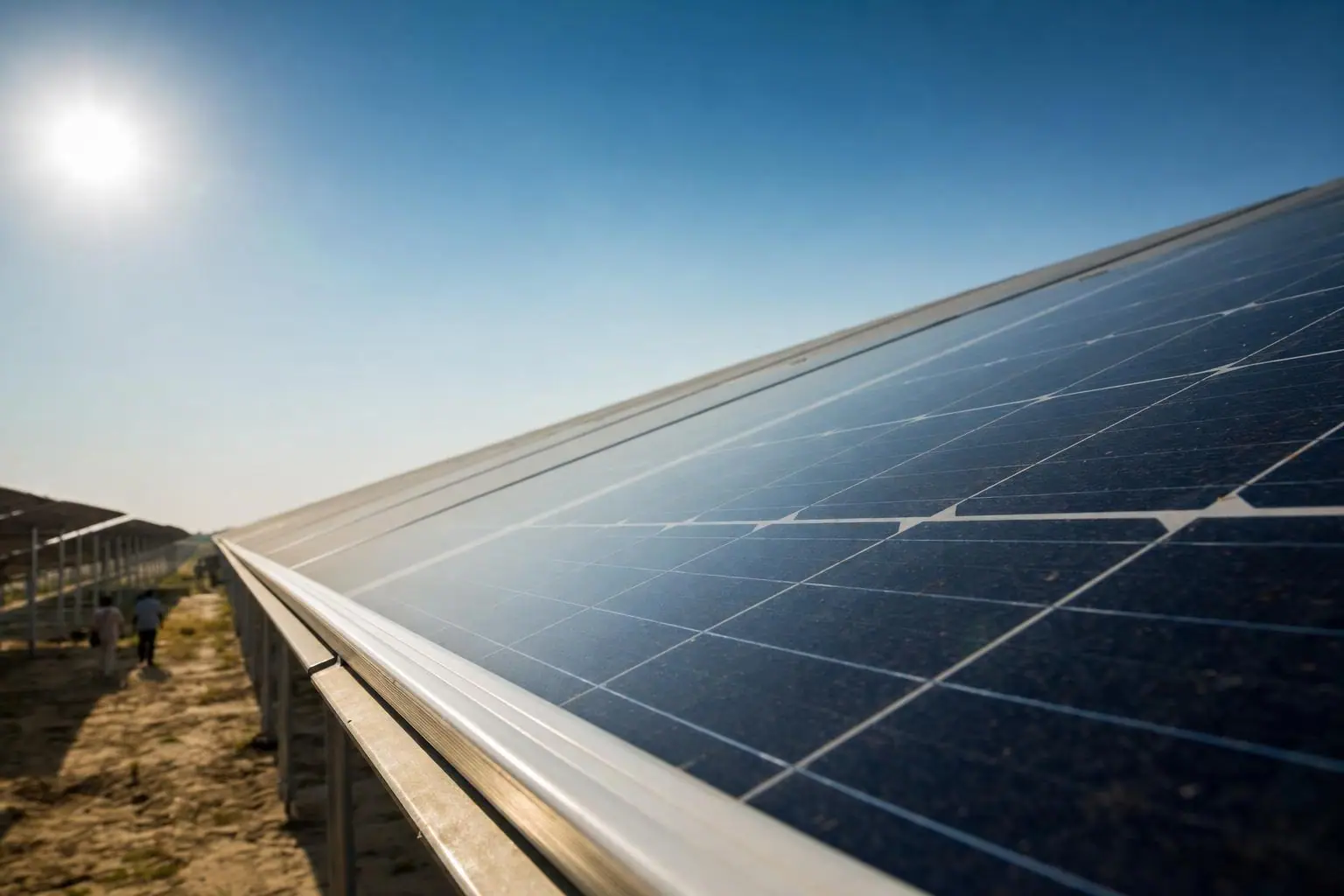 Close-up of Tier-1 bifacial solar panels under a bright sun
